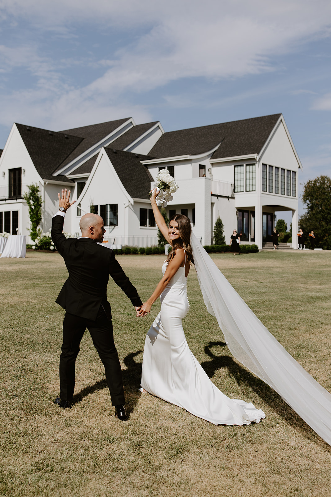 Bride and groom walking about from their ceremony, in celebration!